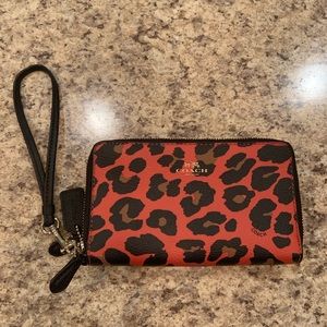 Orange leopard print Coach wristlet